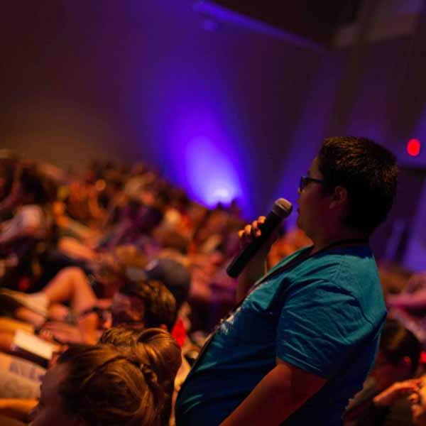 A BCYC Encounter participant asks a question during a speaker presentation